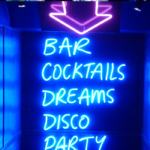 neon signs saying bar, cocktails, dreams disco party